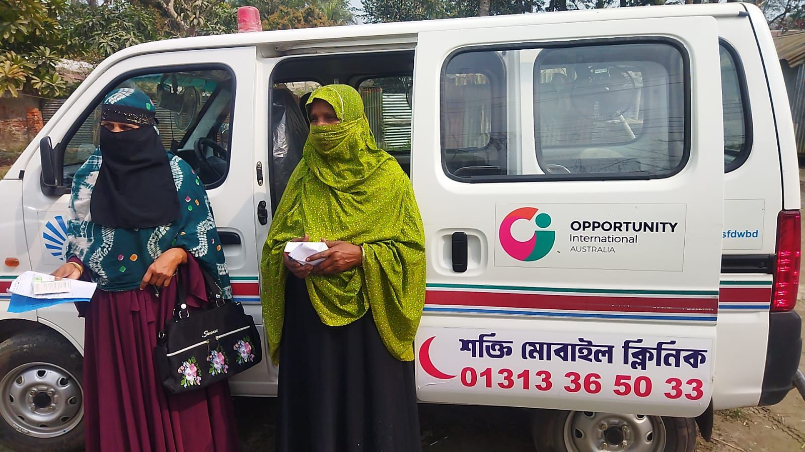 Women in front of a mobile health clinic